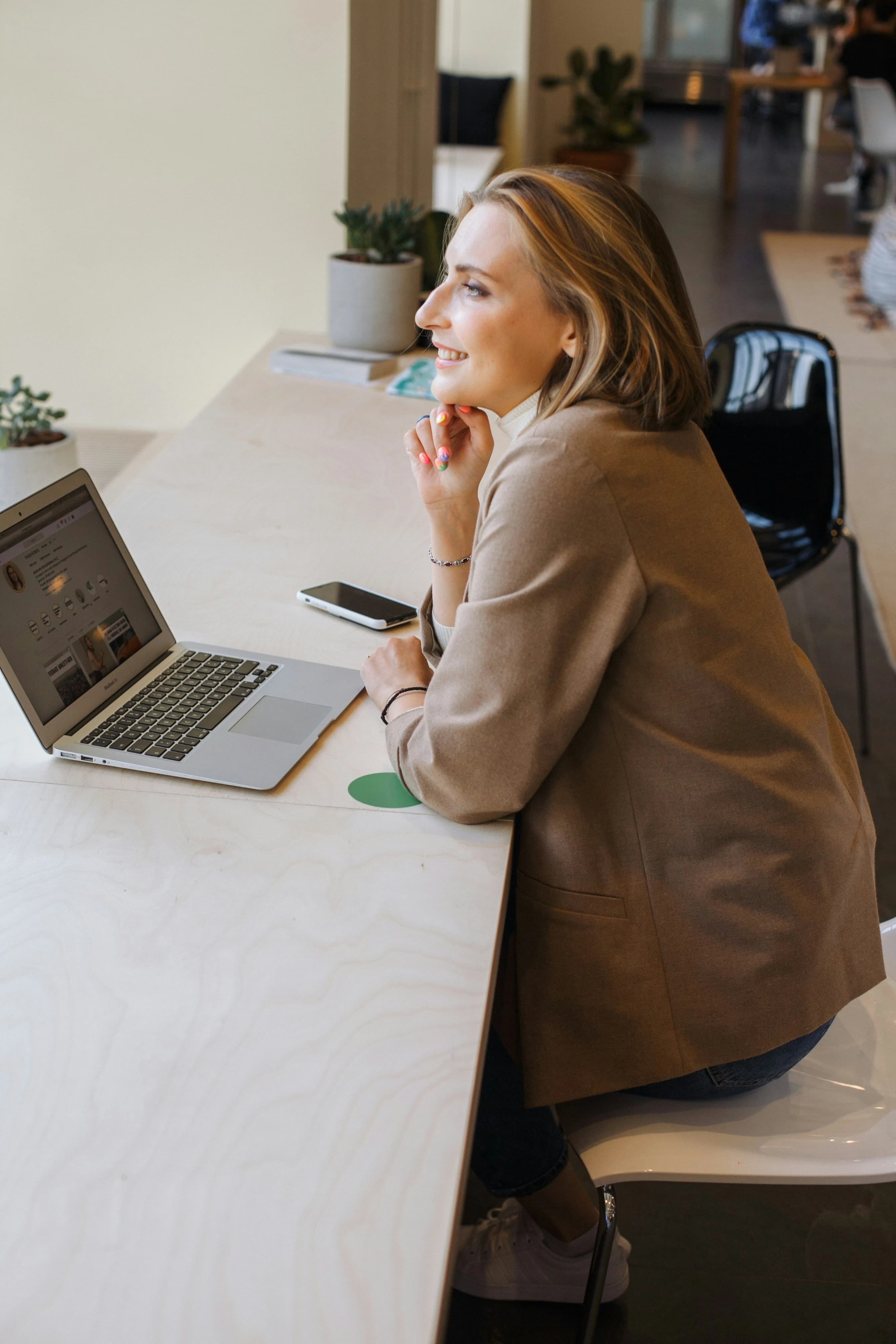 A business partner working on a laptop